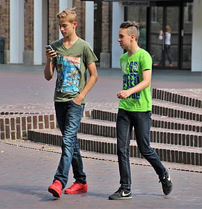 two boys walking on the street thumbnail