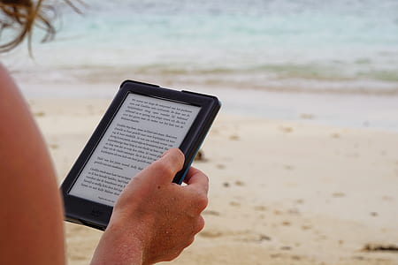 person reading on the black tablet computer thumbnail
