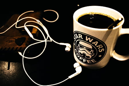 Star Wars Ceramic Mug Filled With Black Liquid With White Canal Buds Beside It thumbnail