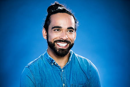 Smiling Man in Blue Photo thumbnail