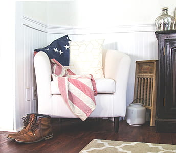 white padded armchair with red textile thumbnail