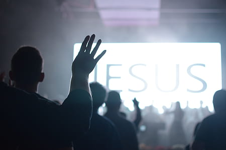 people raising their hands inside room thumbnail