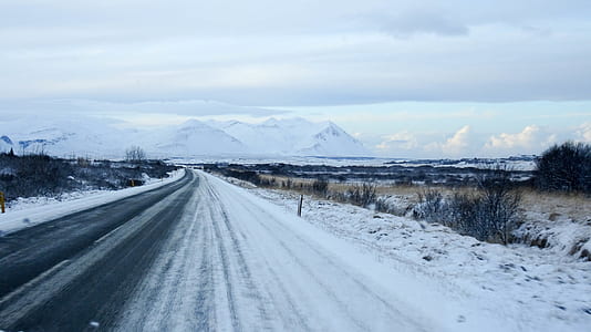 black asphalt road covered with snow plie thumbnail