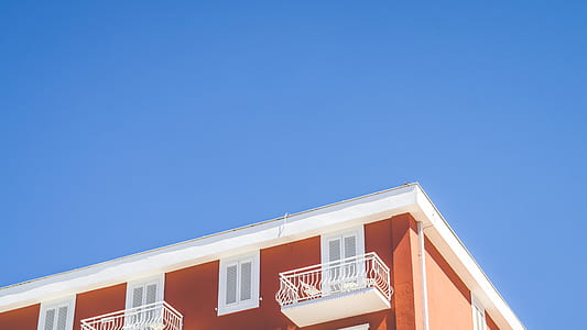 orange and white painted building thumbnail