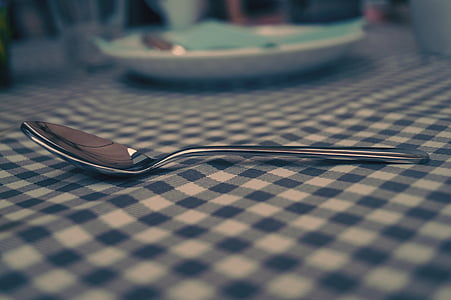 gray stainless steel spoon on table thumbnail