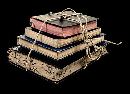 four assorted-color covered books thumbnail