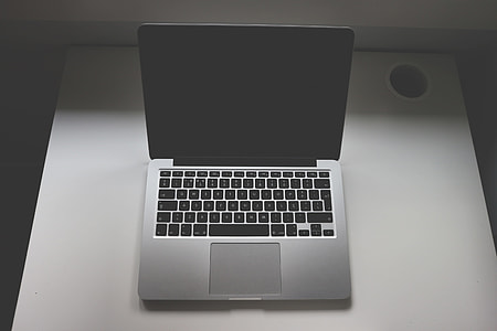 gray and black laptop computer on white table thumbnail