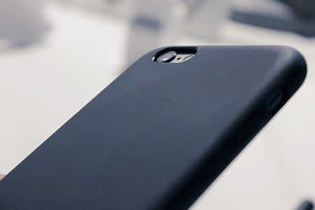 silver iPhone 7 and black case thumbnail