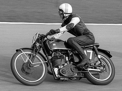 greyscale photo of man riding on motorcycle thumbnail