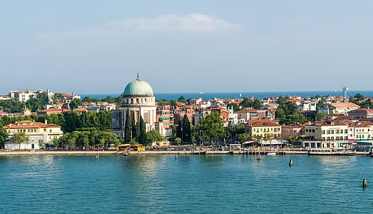 white concrete buildings near body of water during daytime thumbnail