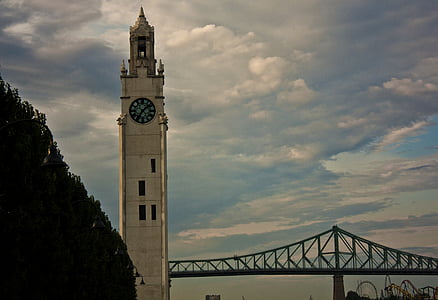 brown bell tower under the cloudy sky thumbnail