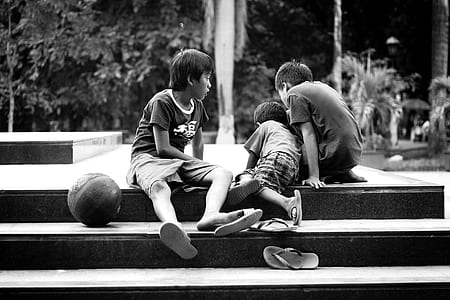 grayscale photo of three boys thumbnail