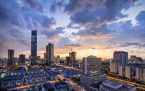 aerial view photography of buildings under cloudy sky thumbnail