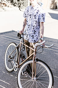 man holding road bike thumbnail