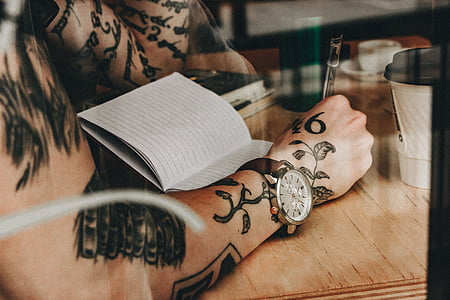 person writing on ruled paper thumbnail