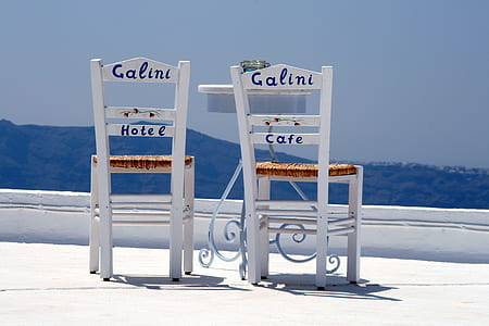 two white wooden chairs at daytime thumbnail