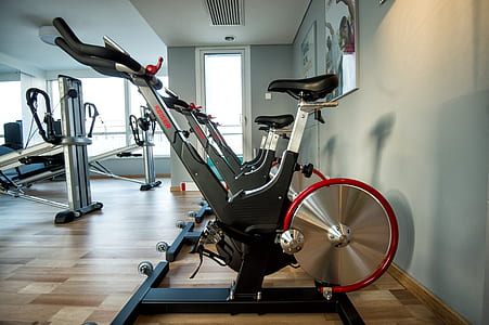 several assorted-color stationary bikes inside gym thumbnail