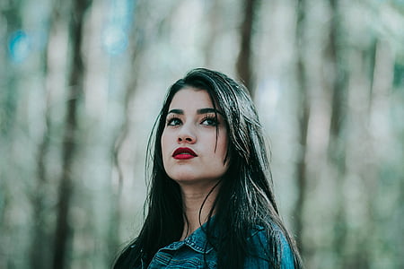 selective focus photography of woman looking up thumbnail