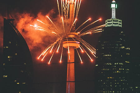 fireworks blasted from Space Needle unto the sky at night time thumbnail