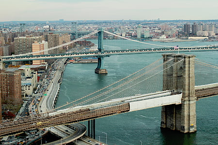 gray concrete bridge near city thumbnail