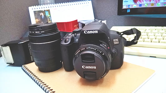 black Canon EOS 100D on brown spring notebook thumbnail