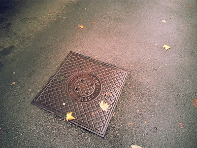 rectangular brown metal manhole cover thumbnail