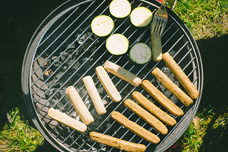 Vegan sausages and zucchini on grill thumbnail