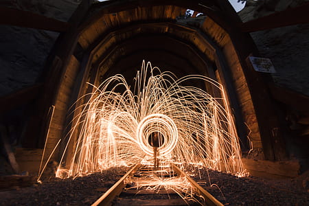 timelapse photography of person between ring of fire in train railway thumbnail