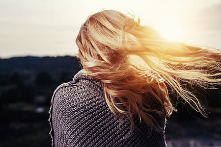 woman in gray poncho while unwind during daytime thumbnail