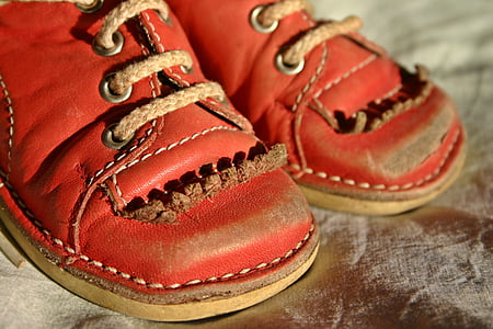pair of red leather shoes on brown surface thumbnail
