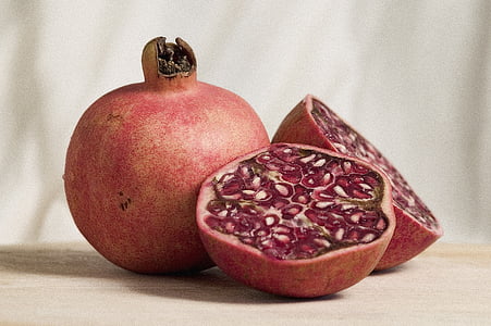 purple sliced fruit on beige surface thumbnail
