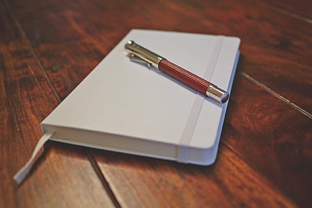 pen on white planner thumbnail