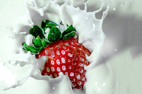 timelapse photography of strawberry tossed into milk thumbnail