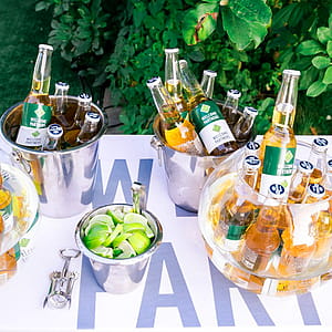 Photography of Beer Bottles on Buckets thumbnail