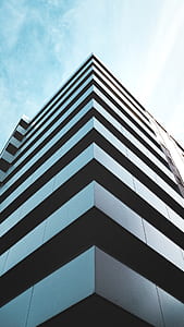 gray concrete building under white sky thumbnail