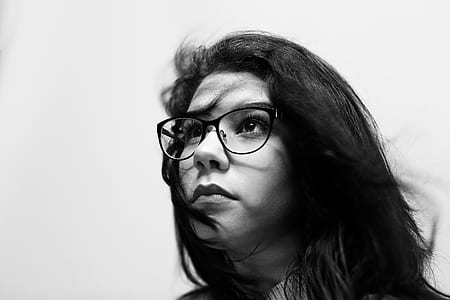 grayscale photography of woman looking up thumbnail