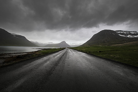 grayscale photography of mountain near road thumbnail