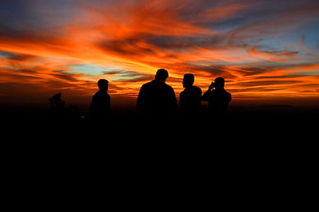 silhouette of person standing at golden hour thumbnail