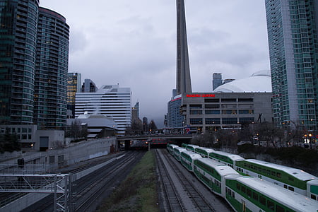 white and green train on train railroad thumbnail