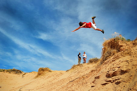 man jumping on cliff thumbnail