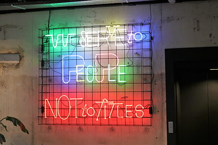 multicolored neon signage mounted on wall thumbnail