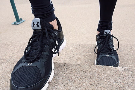pair of black-and-white Under Armour mesh running shoes thumbnail