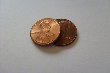 two round gold-colored liberty coins thumbnail