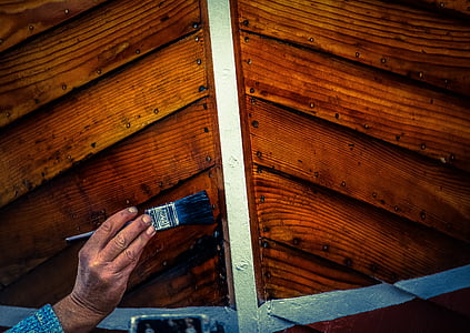 person holding grey paint brush thumbnail