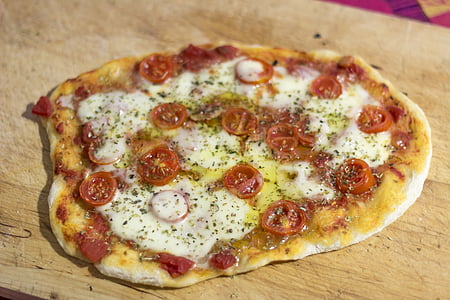 baked pizza on wooden surface thumbnail