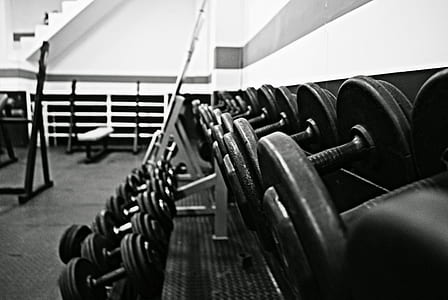 assorted dumbbells in grayscale photography thumbnail