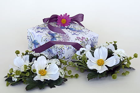 white petaled flowers beside purple box thumbnail
