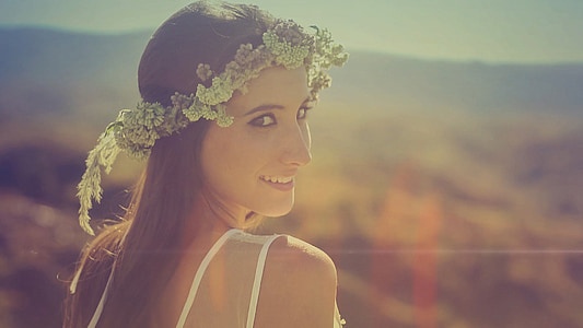 woman wearing green floral head dress thumbnail