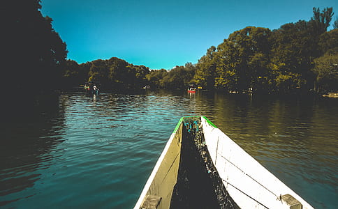 White Boat on Body of Water during Daytime thumbnail