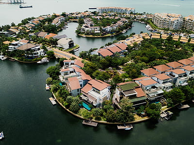 aerial view of building surrounded body of water thumbnail
